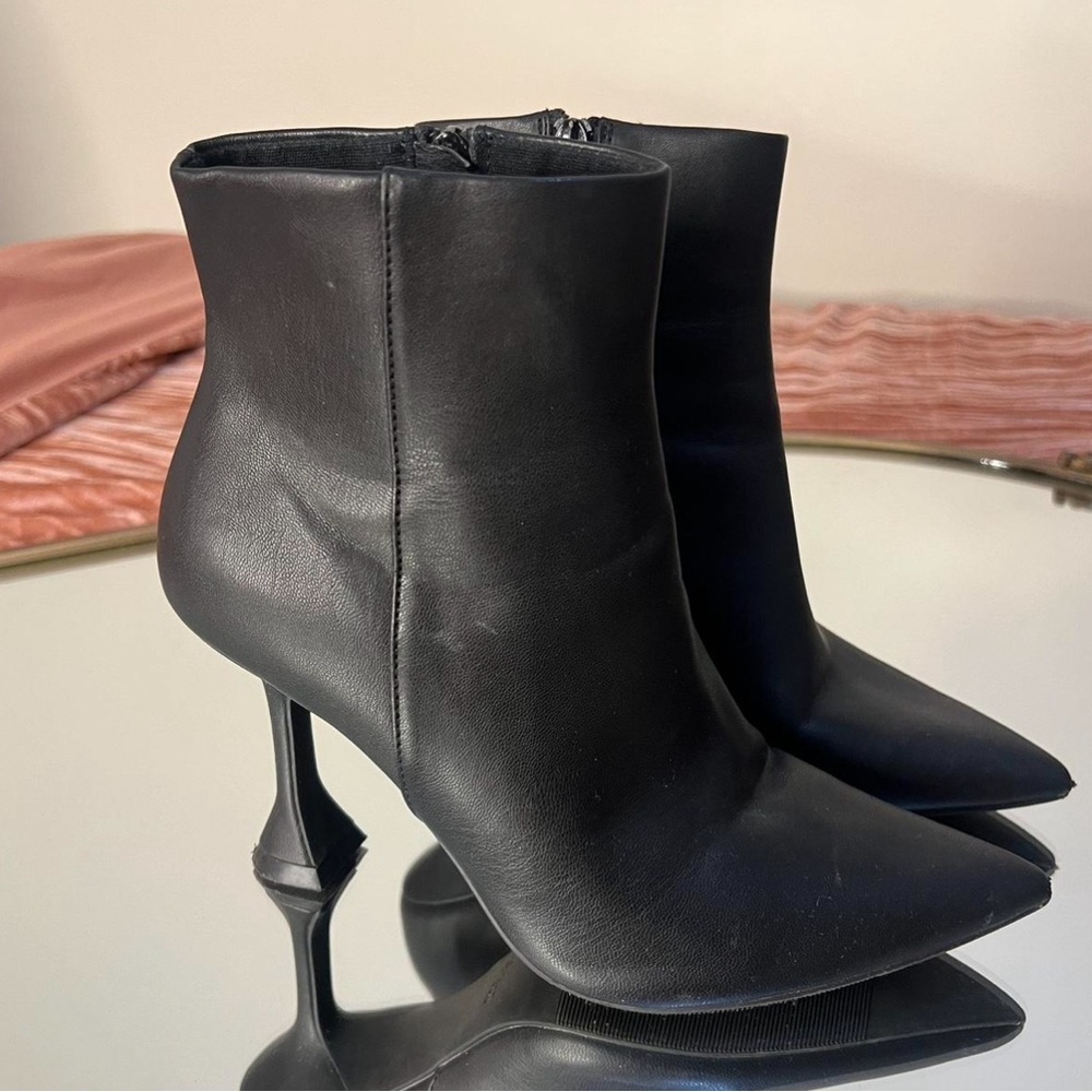black boots with unique heel